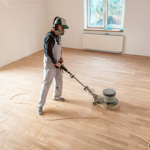 the professional master polishes the parquet with special machine